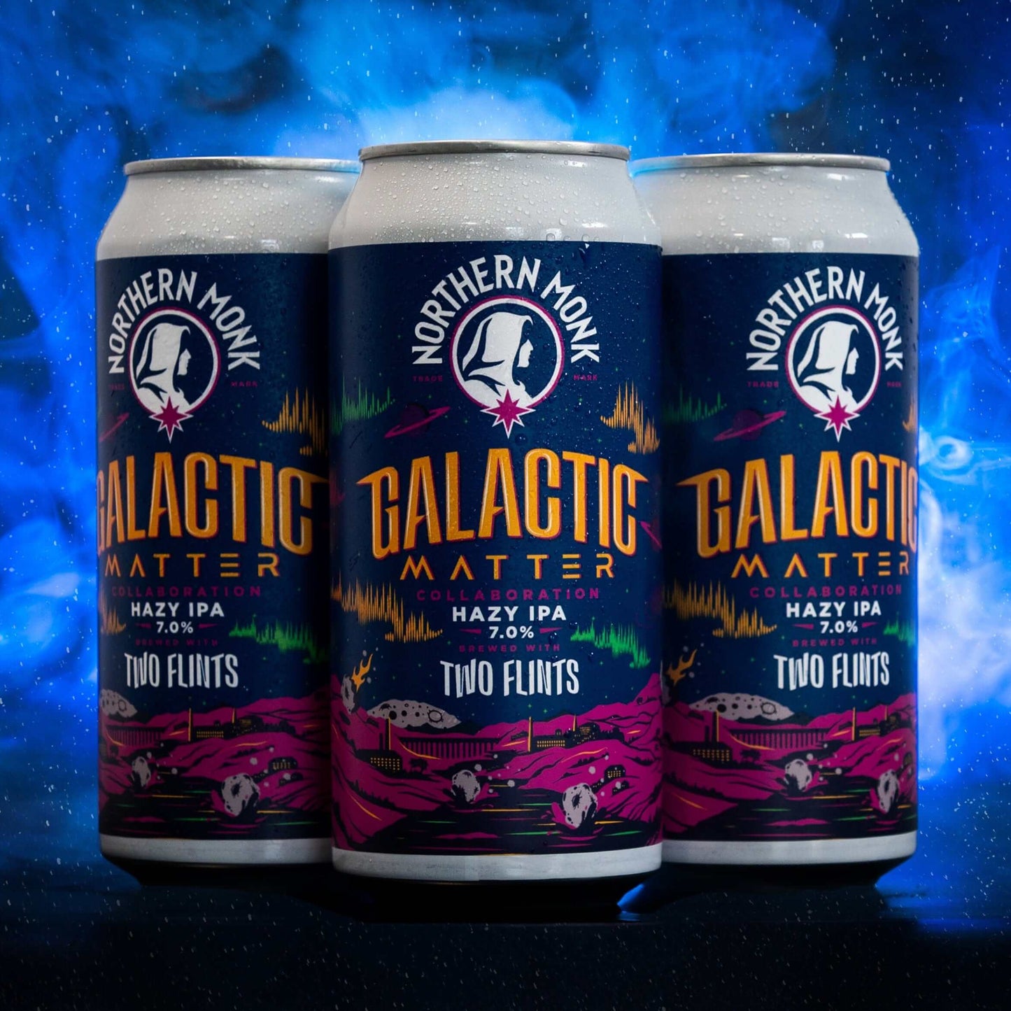 Three cans of Galactic Matter Hazy IPA by Northern Monk, cosmic design with vibrant colors, showcasing 7.0% ABV.