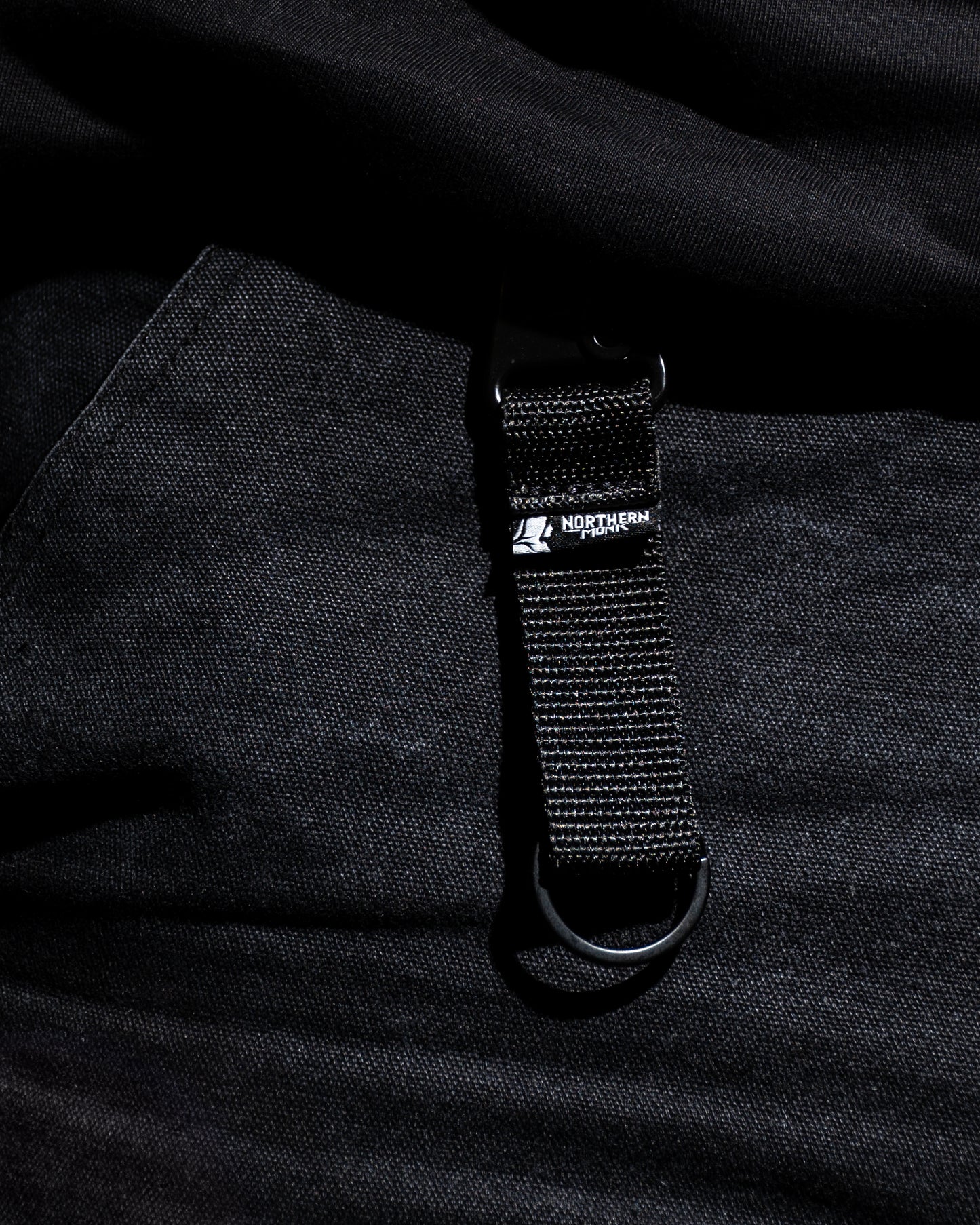 Black strap with a brand logo on a black background