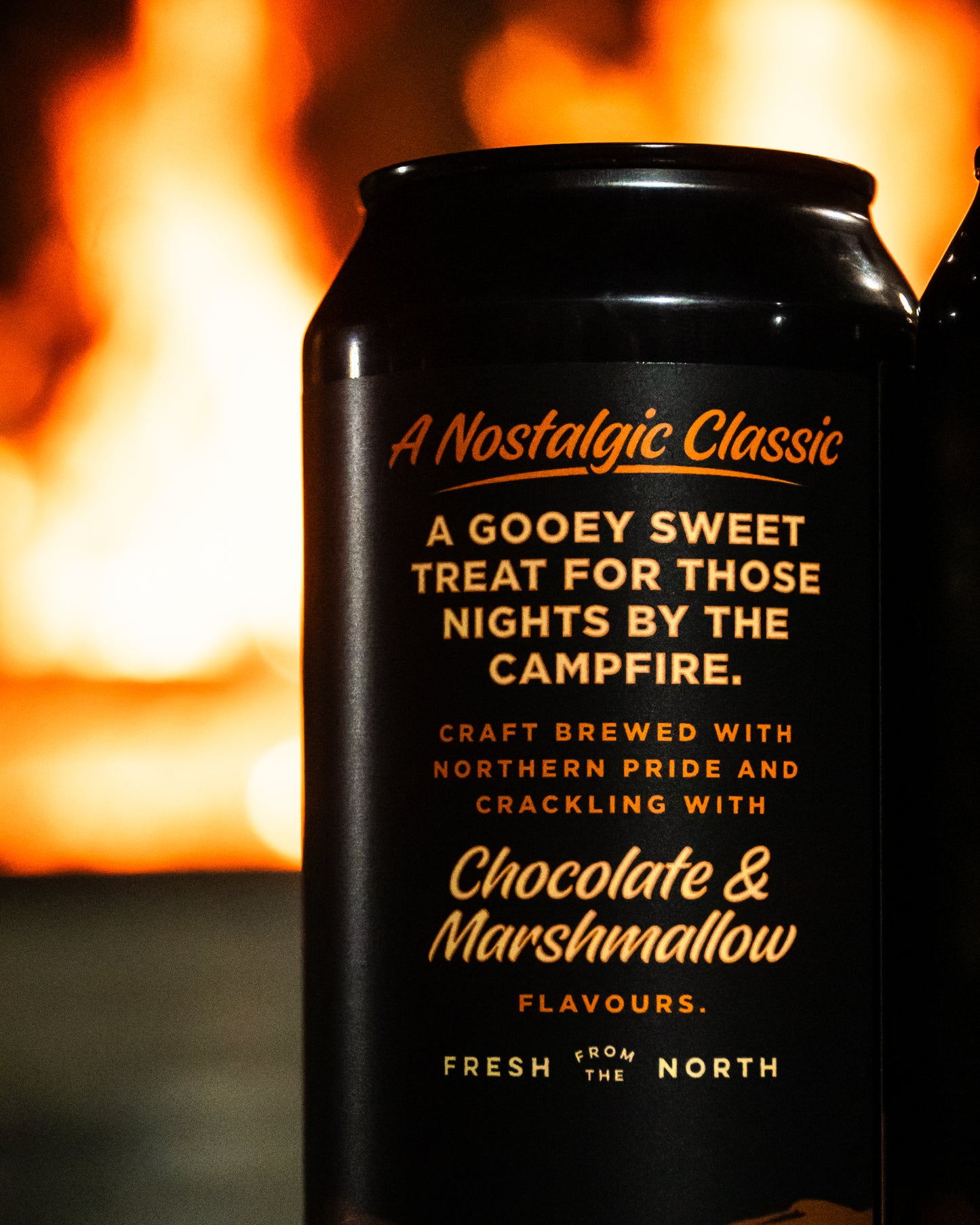 Black can with gold text against a fiery background