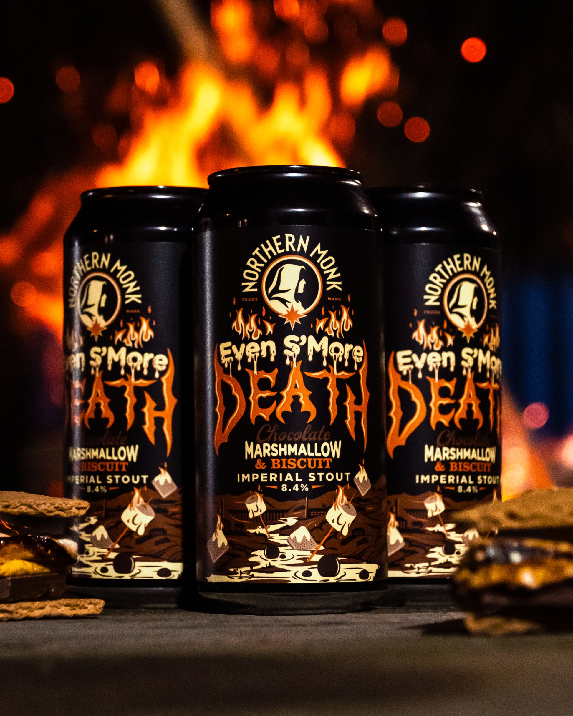 Three cans of 'Even S'more Death' Imperial Stout with a fiery background