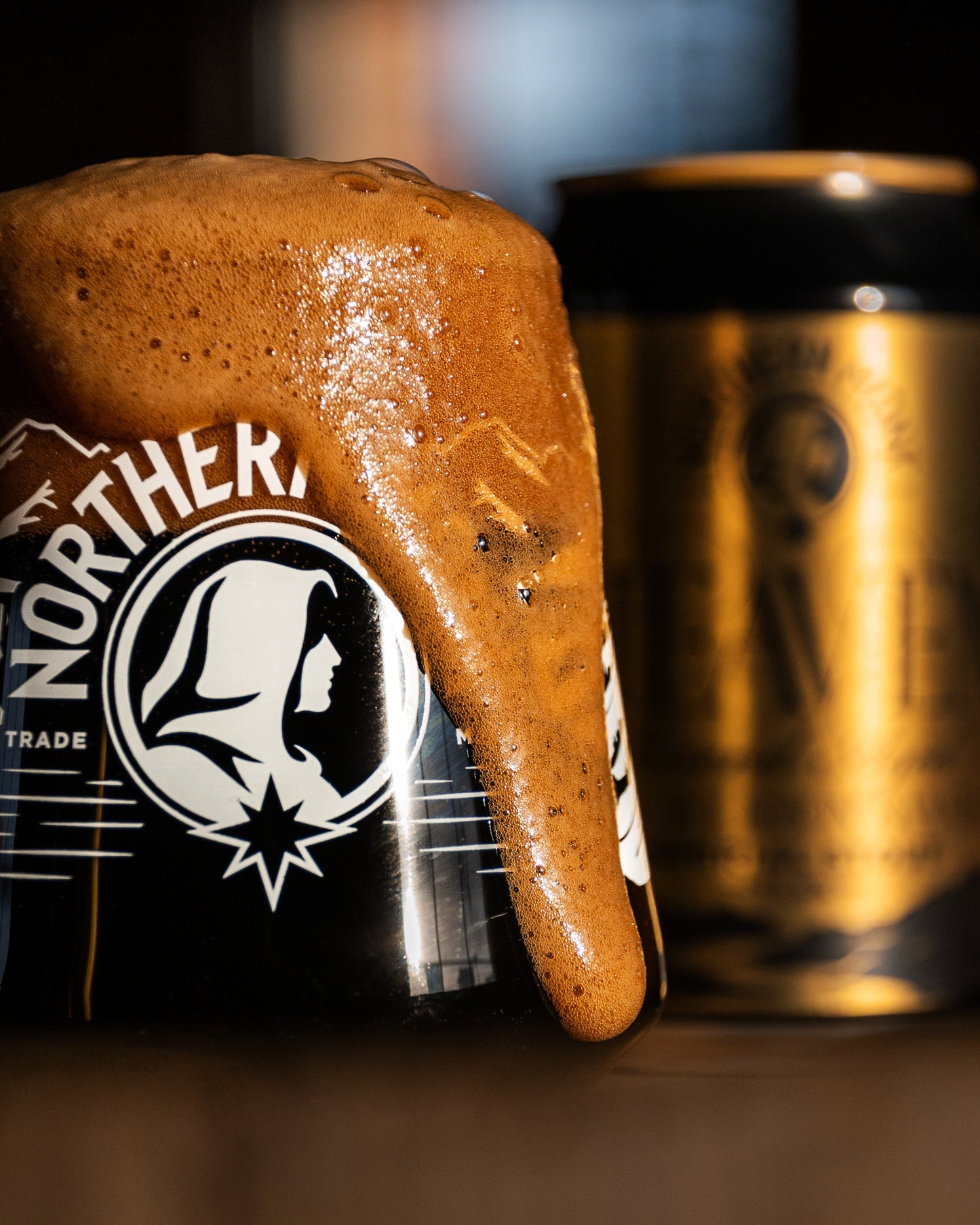 Close-up of a Northern Monk glass overflowing with Barrel Aged Heaven