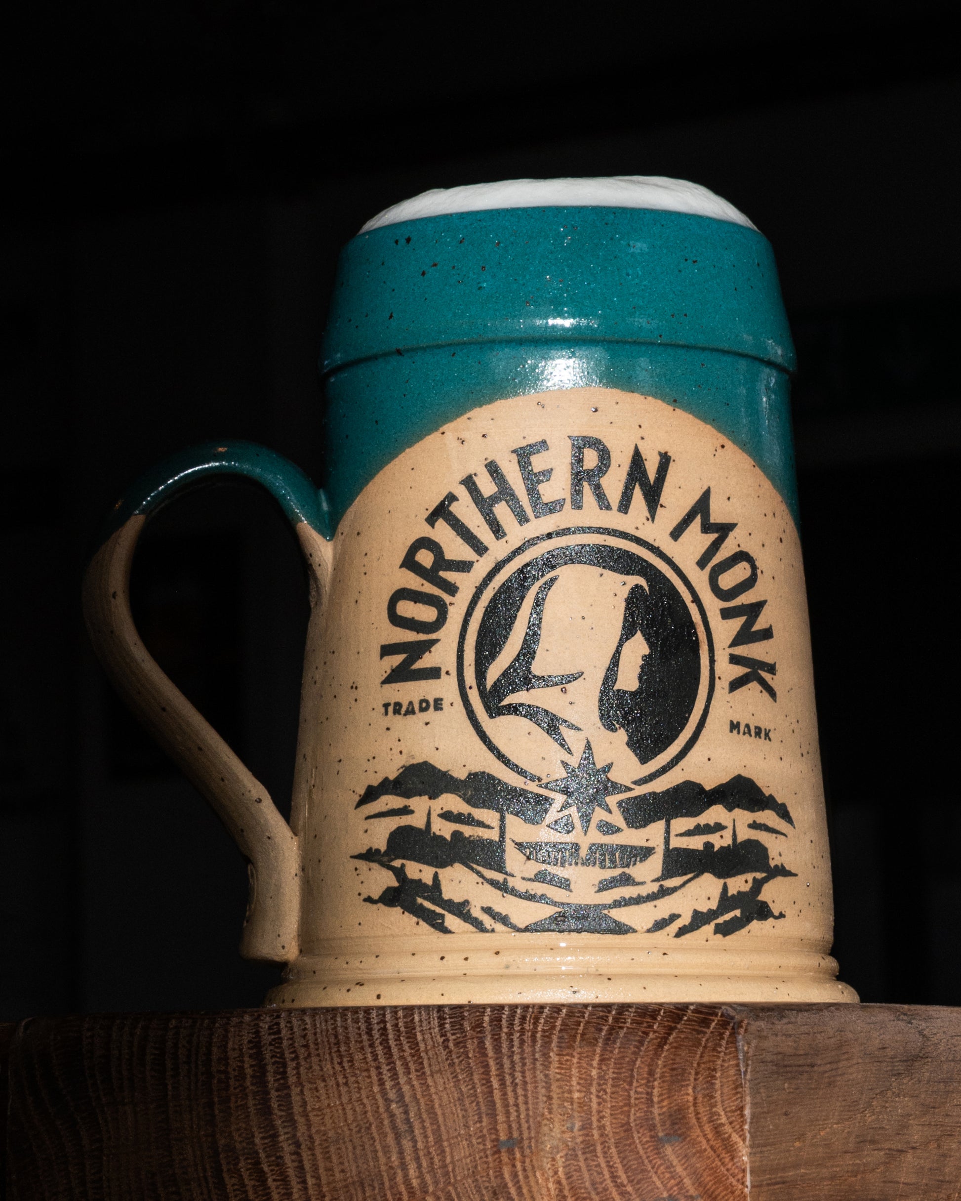 Beige and teal finished pint tankard featuring 'Northern Monk' branding