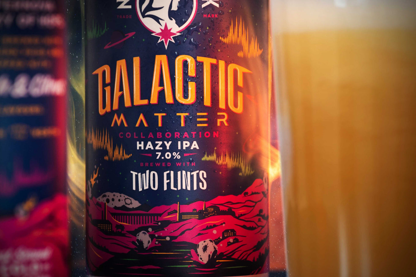Galactic Matter Hazy IPA 7.0% can featuring cosmic design with peach and citrus flavors, brewed by Two Flints.